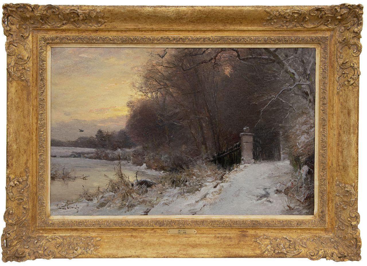 Apol L.F.H.  | Lodewijk Franciscus Hendrik 'Louis' Apol, Sneeuwlandschap bij een toegangspoort bij Haagse Bosch, olieverf op doek 45,5 x 70,3 cm, gesigneerd linksonder